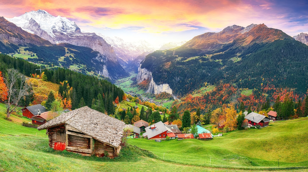 Scenic autumn view of picturesque alpine Wengen village and Lauterbrunnen Valley