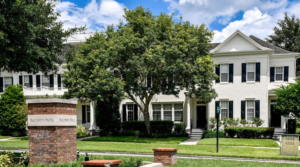 Entrance sign at Baldwin Park in Orlando, Florida. A tranquil, primarily residential community with tree-lined streets featuring quaint cafes, restaurants, bars, and shops.