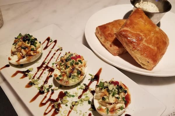 Spiced deviled eggs with wasabi peas and tarragon biscuits for a great start.