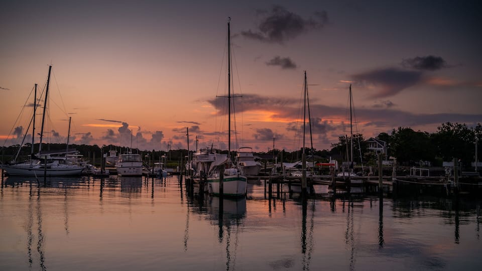 Sailboats at a marina at dawn in Beaufort North Carolina.