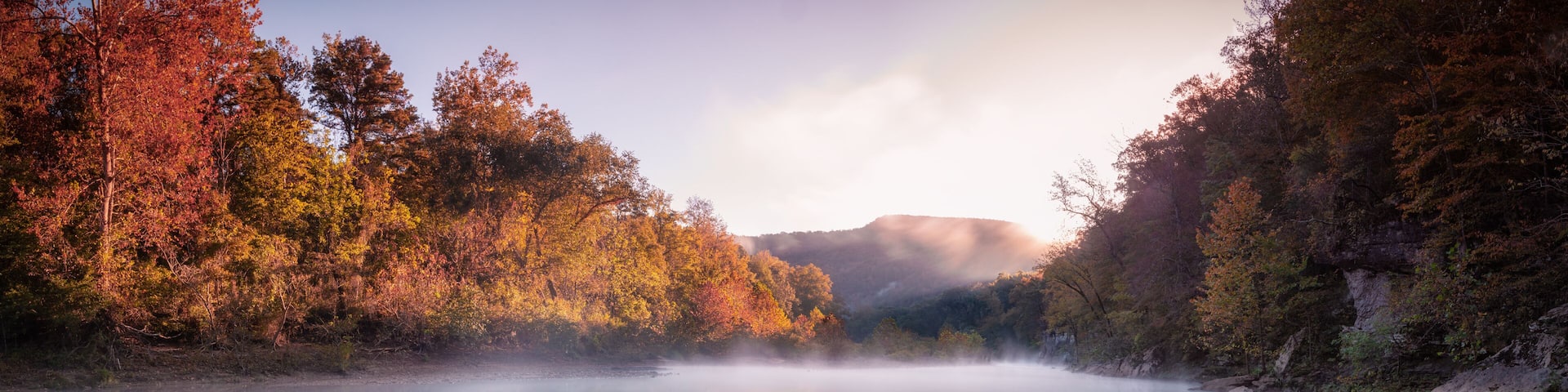 Panorama of Sunrise above Foggy River