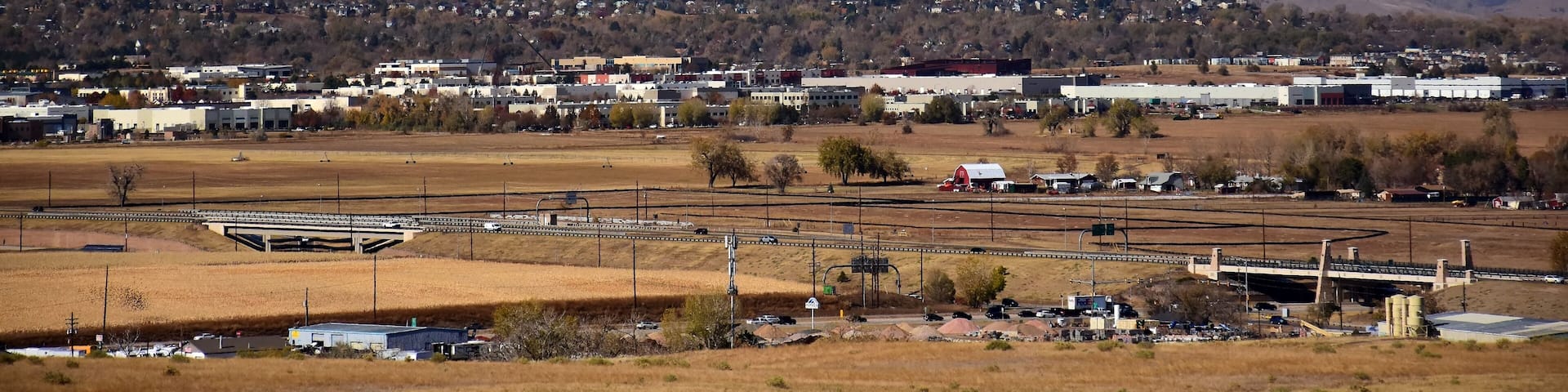 looking out at long's peak, rock creek open space, and the front range of colorado's rocky mountains from broomfield, colorado, on a sunny day in early winter