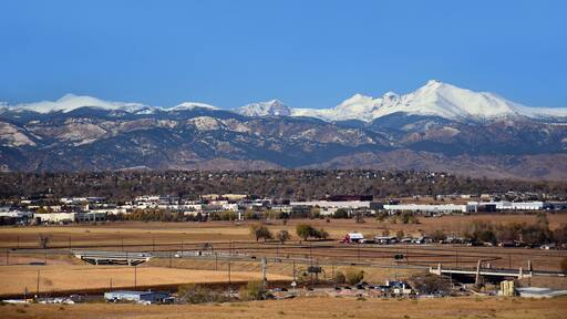 looking out at long's peak, rock creek open space, and the front range of colorado's rocky mountains from broomfield, colorado, on a sunny day in early winter