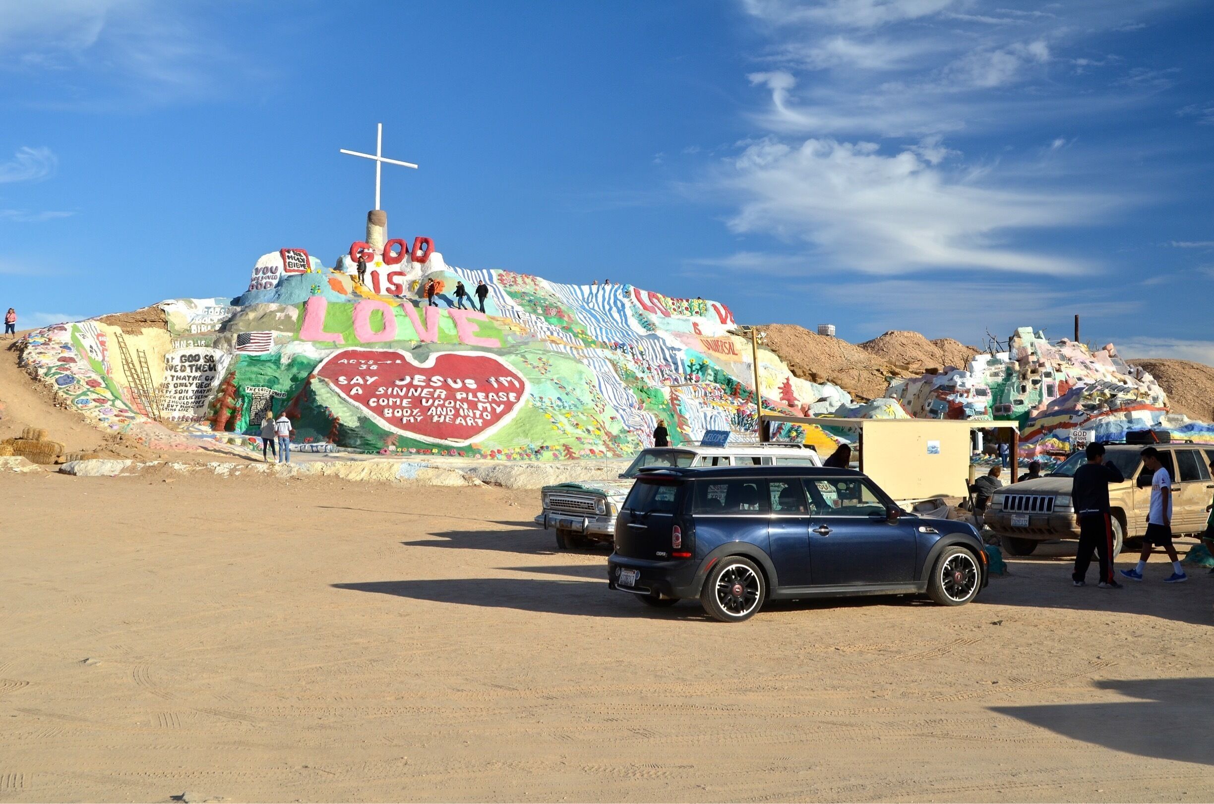 The artwork is made from adobe, straw, and thousands of gallons of lead-free paint. Salvation Mountain was created by local resident Leonard Knight (1931–2014).[1] It encompasses numerous murals and areas painted with Christian sayings and Bible verses, though its philosophy was built around the Sinner's Prayer.