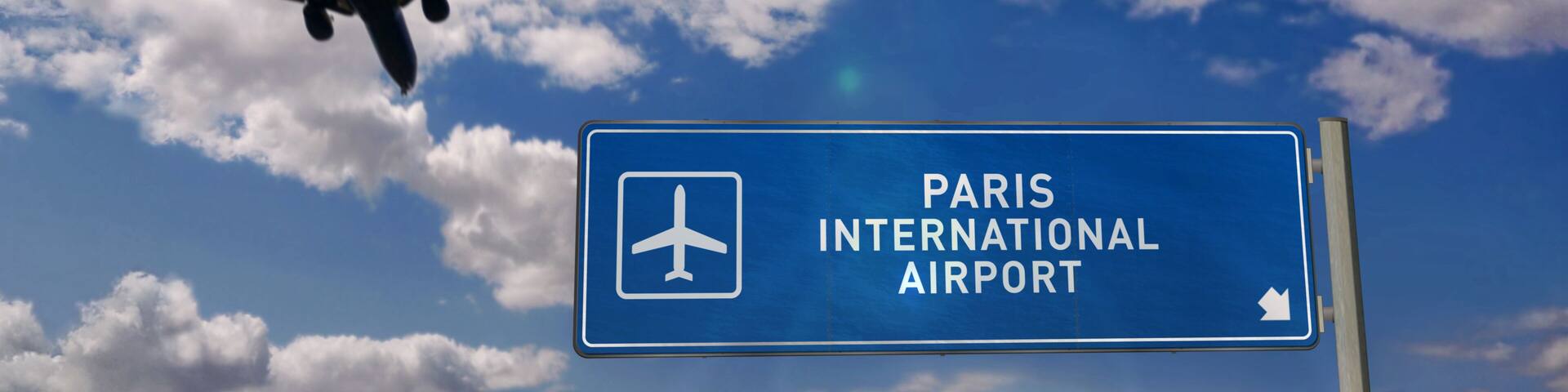 Plane landing in Paris France with signboard