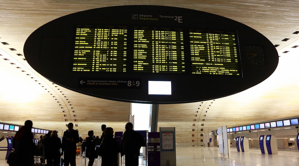 People standing near display board in airport