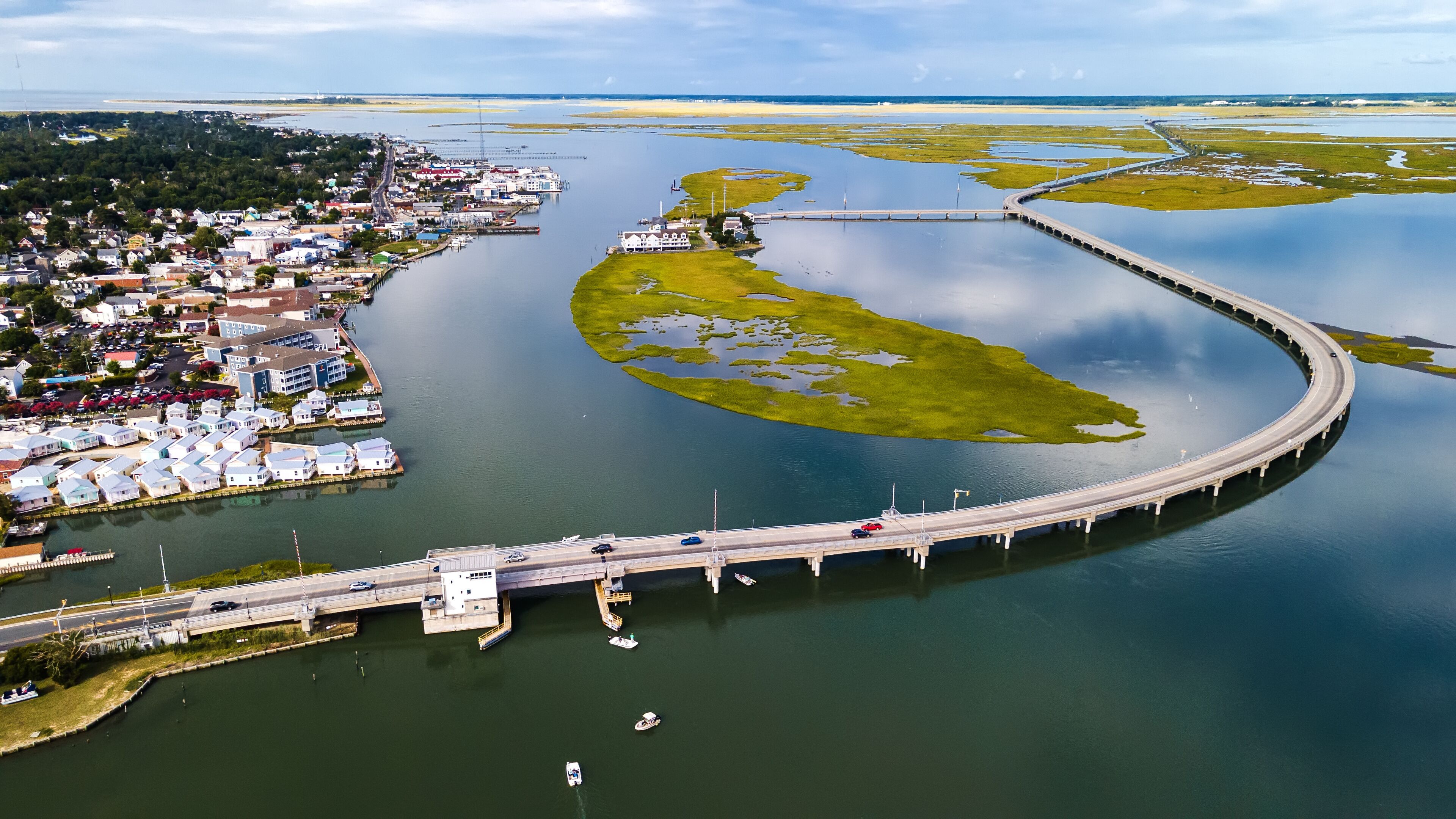 Chincoteague bridge across the Chincoteague Bay in Virginia and views of the waterfront. Drone view.