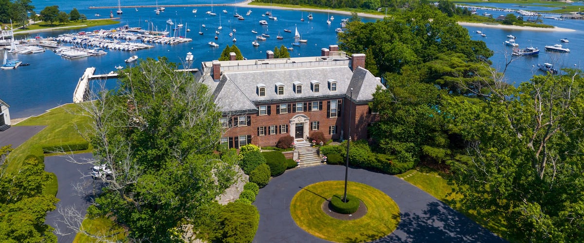 The Oaks historic waterfront mansion aerial view at 49 Margin Street at Cohasset Cove in town of Cohasset, Massachusetts MA, USA.