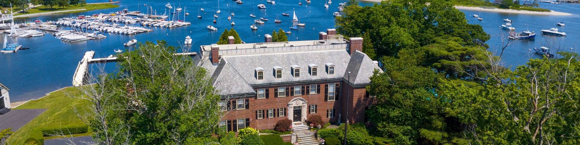 The Oaks historic waterfront mansion aerial view at 49 Margin Street at Cohasset Cove in town of Cohasset, Massachusetts MA, USA.