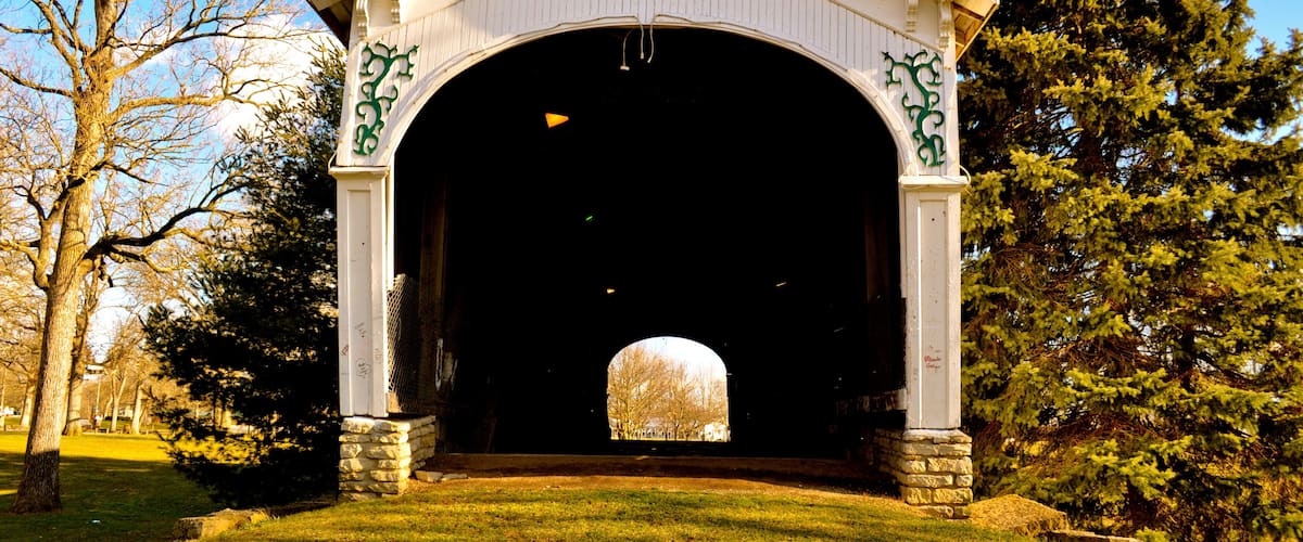 A covered bridge with the inscription "1884 Built by Kennedy Bros."