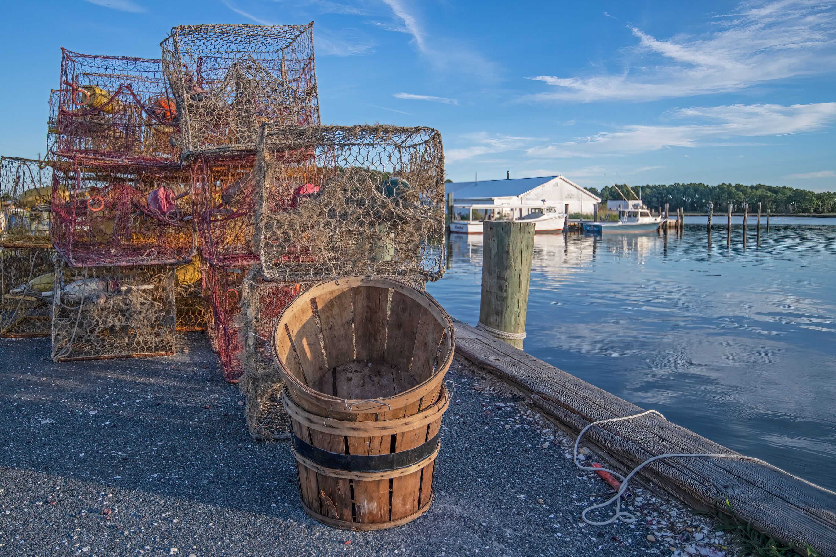 Crab pots and baskets along a Chesapeake Bay jetty.