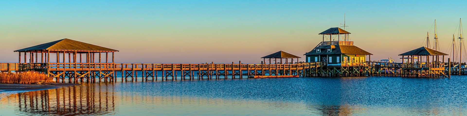 Pier plus covered picnic areas on the Gulf in Long Beach Mississippi area, late light.