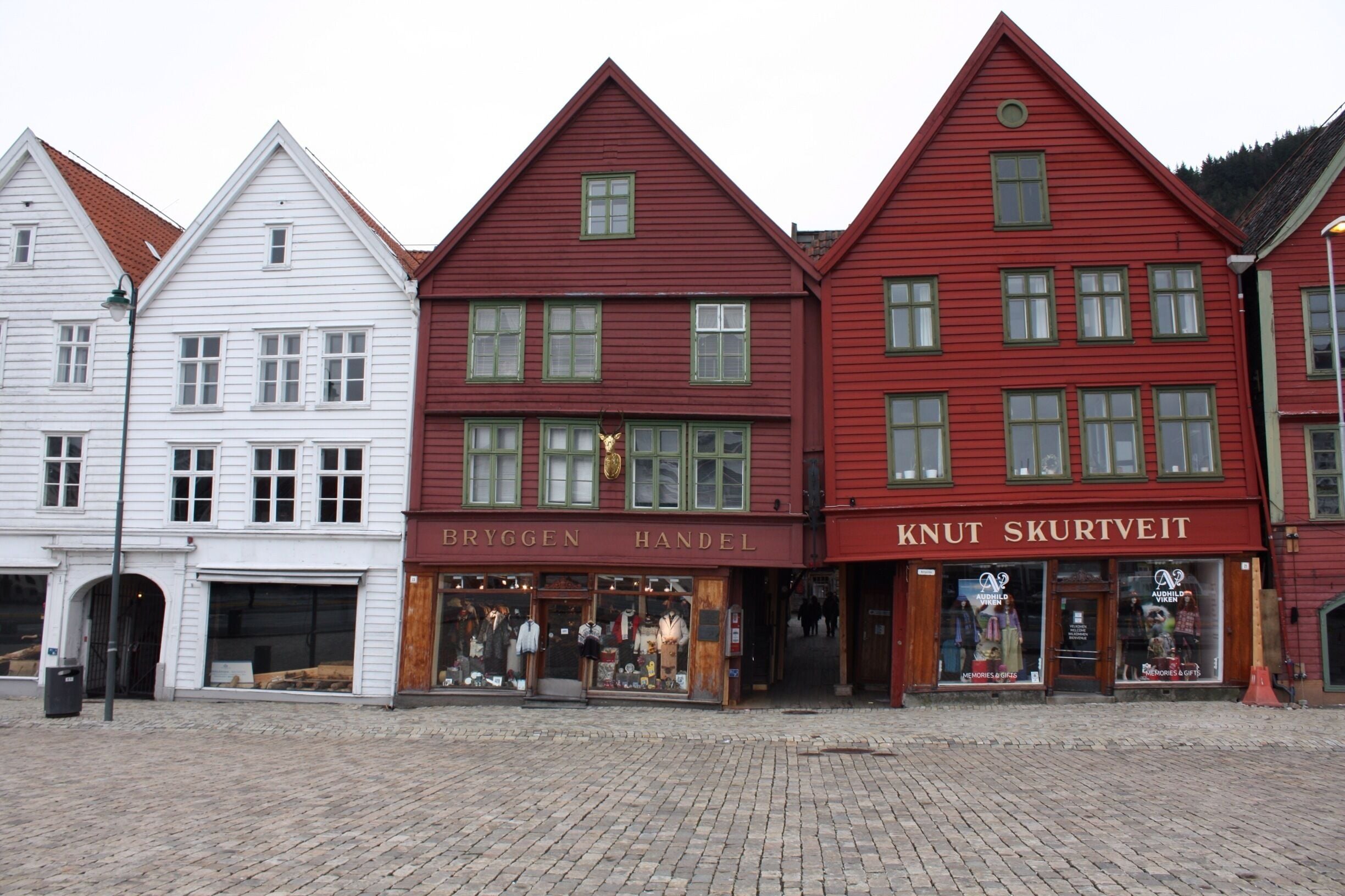 Bryggen (Norwegian for the Wharf), also known as Tyskebryggen (the German Wharf), is a series of Hanseatic commercial buildings lining the eastern side of the fjord coming into Bergen, Norway. Bryggen is on the UNESCO list.   I don't know if you can see it, but the houses tilt against each other