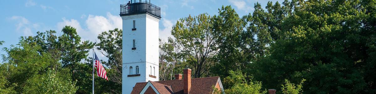 The 68 feet (21 m) tall Presque Isle Lighthouse is situated on the northern shoreline of Presque Isle State Park.