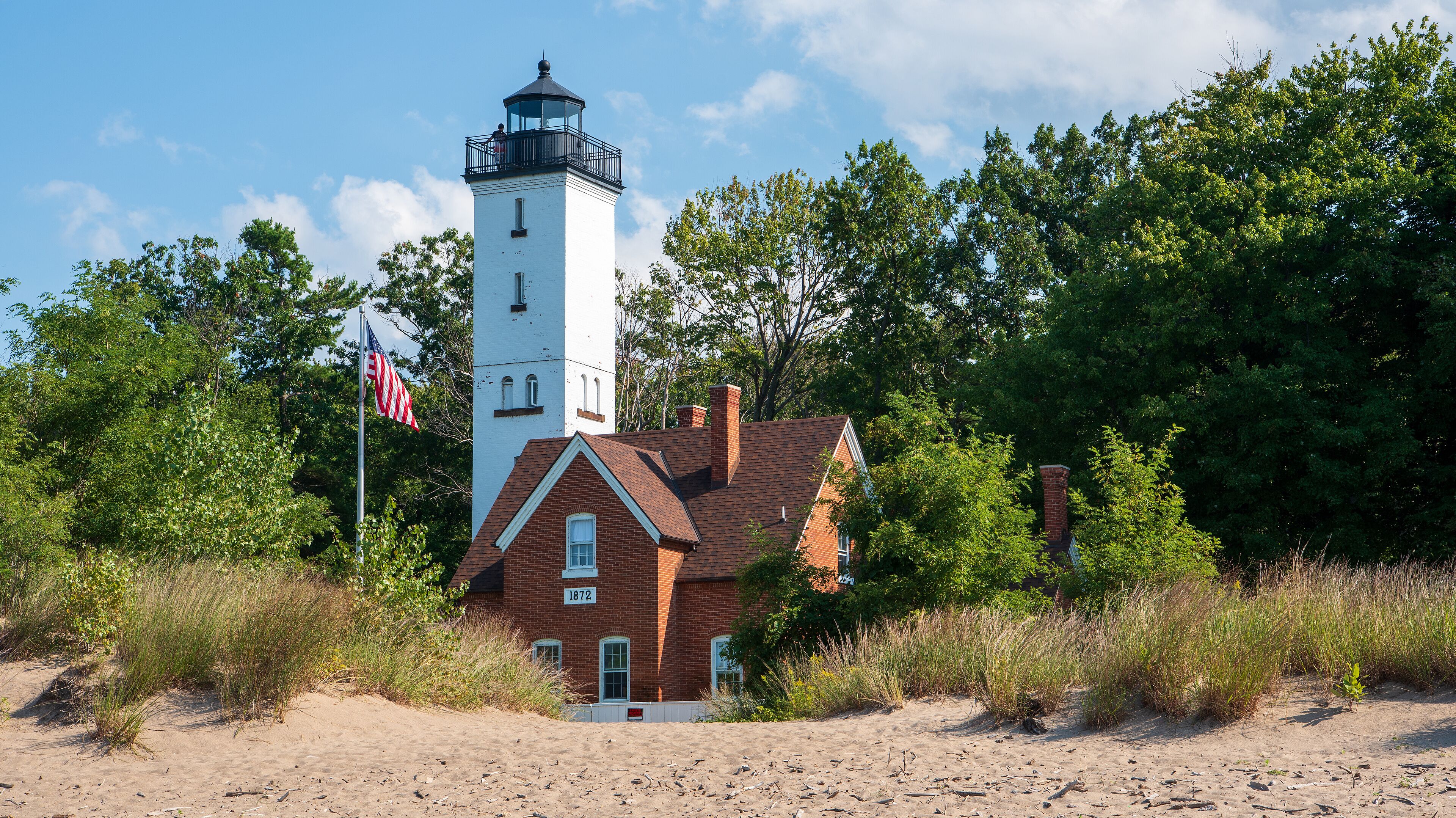 The 68 feet (21 m) tall Presque Isle Lighthouse is situated on the northern shoreline of Presque Isle State Park.