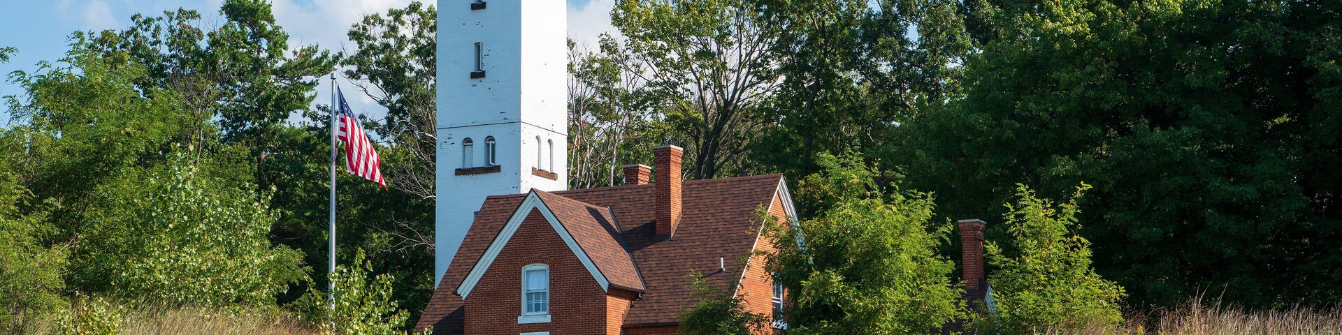 The 68 feet (21 m) tall Presque Isle Lighthouse is situated on the northern shoreline of Presque Isle State Park.