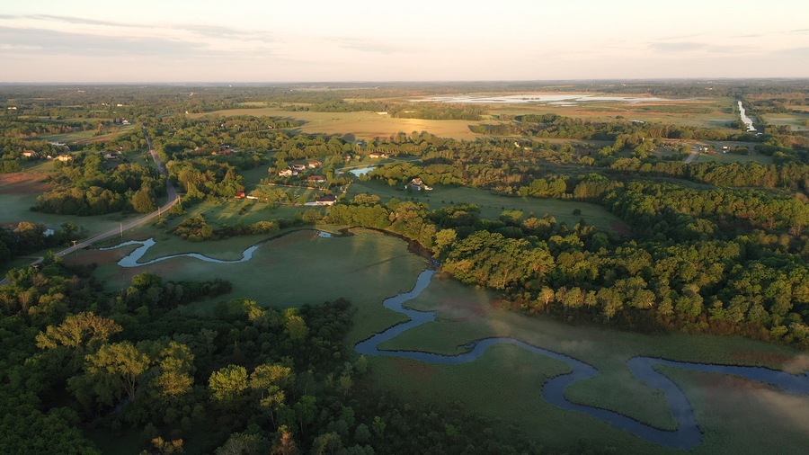 Aerial view of american countryside in the summertime. Sunrise, dawn, misty early morning. North american rural landscape,  Beautiful nature of Midwest