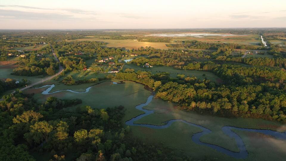 Aerial view of american countryside in the summertime. Sunrise, dawn, misty early morning. North american rural landscape, Beautiful nature of Midwest