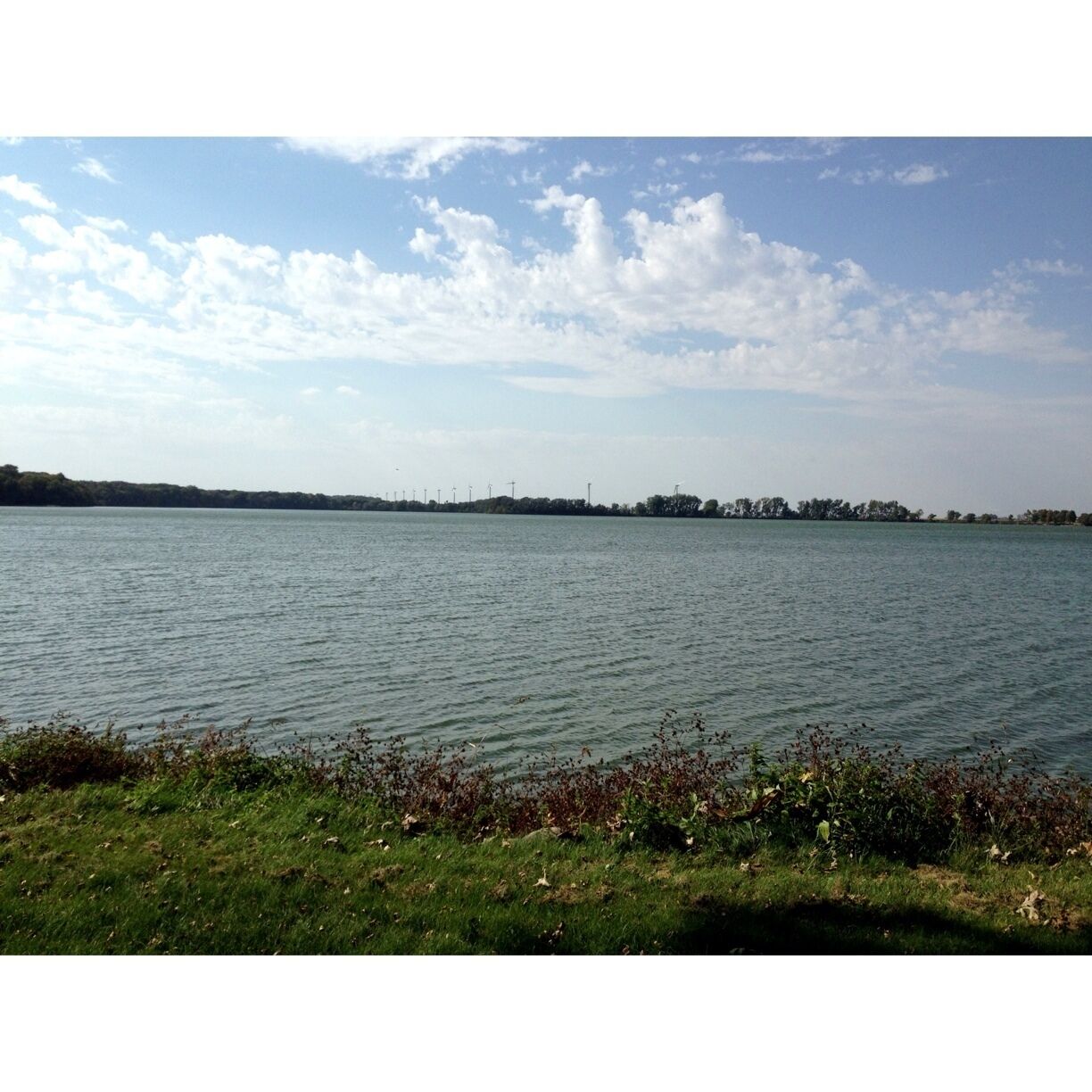 Windmills hovering in the distance over Crystal Lake.