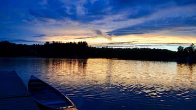 Sunset over a tranquil lake in Greenville, Michigan