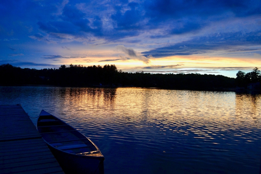 Sunset over a tranquil lake in Greenville, Michigan