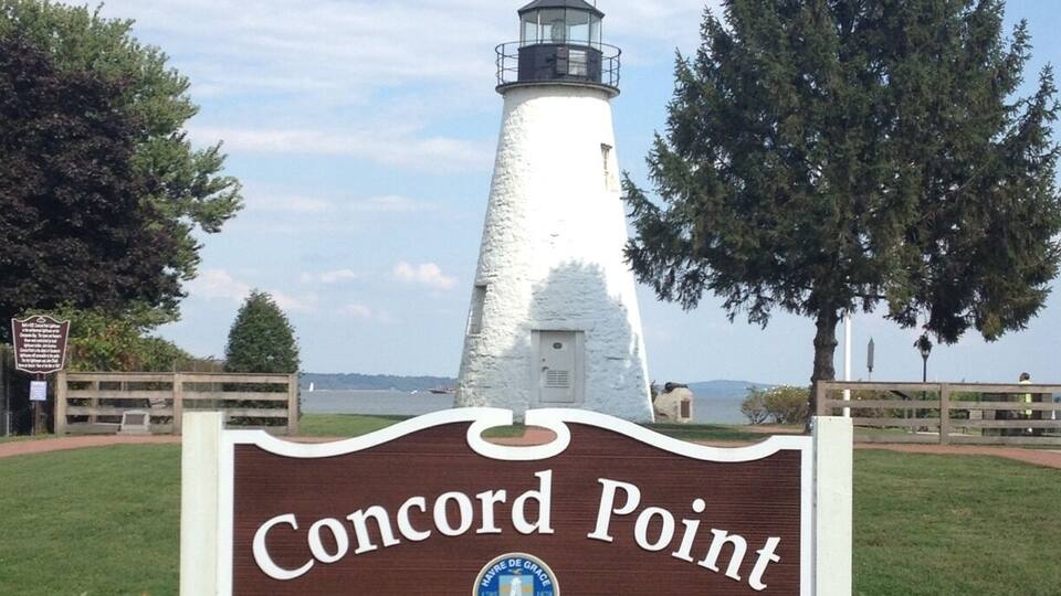 A lighthouse named Concord Point Lighthouse with a clear view of the surrounding landscape.