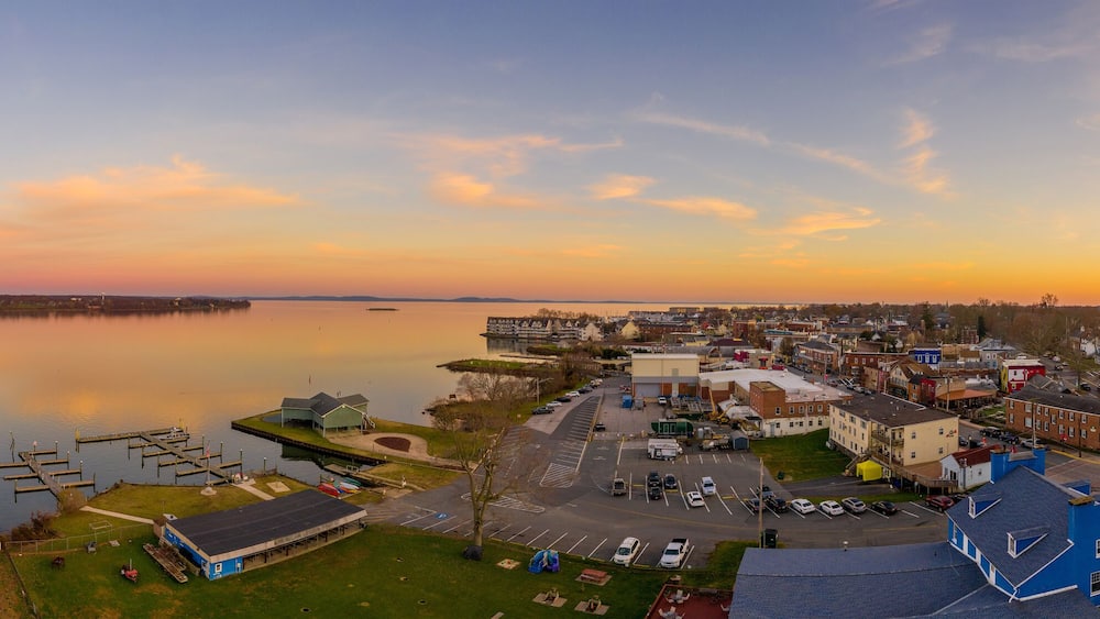 Aerial sunset panorama of Havre de Grace Maryland with orange sky and clouds reflecting on the Susquehanna River and the Chesapeake Bay one of the best small towns in America