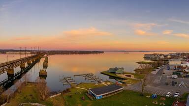 Aerial sunset panorama of Havre de Grace Maryland with orange sky and clouds reflecting on the Susquehanna River and the Chesapeake Bay one of the best small towns in America