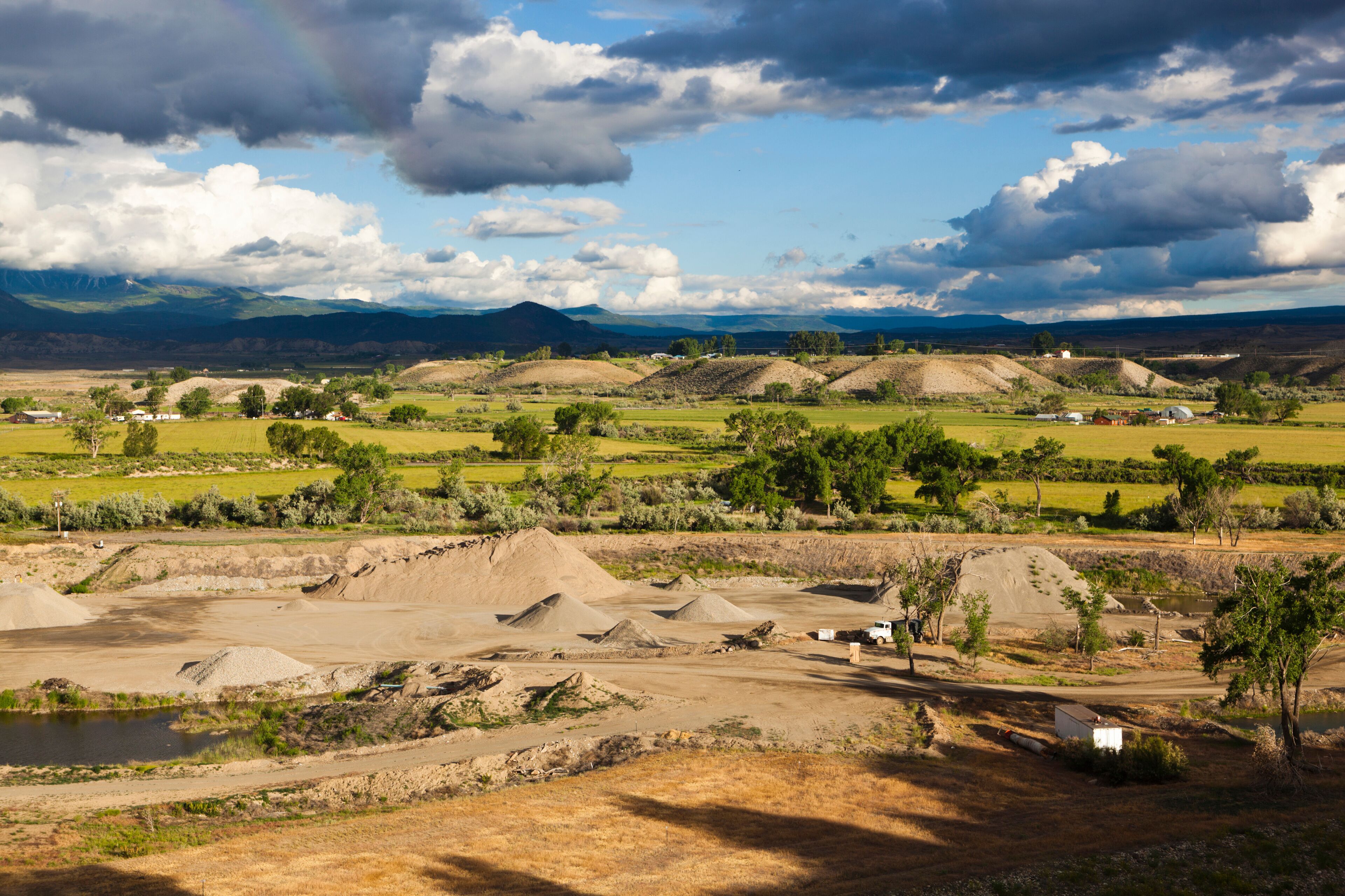 Croplands, gravel piles, and terraces in the North Fork Valley near Hotchkiss, Colorado.