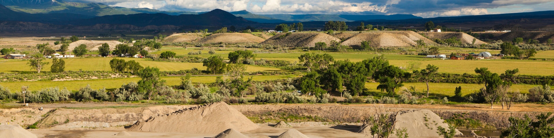 Croplands, gravel piles, and terraces in the North Fork Valley near Hotchkiss, Colorado.