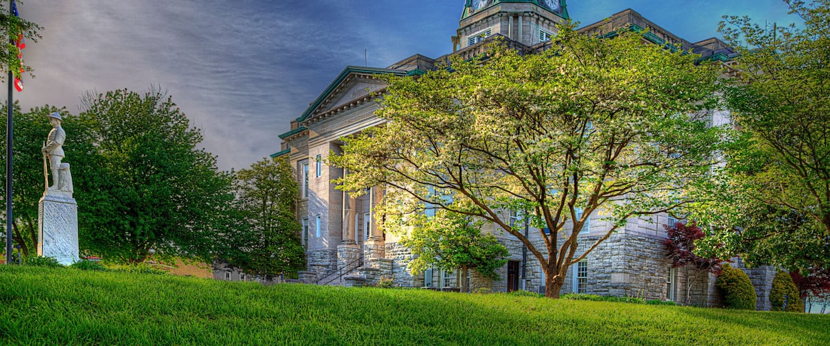 Soldier Standing Guard at the Courthouse. A monument to the soldiers that fought in the First World War stands quietly at parade rest.