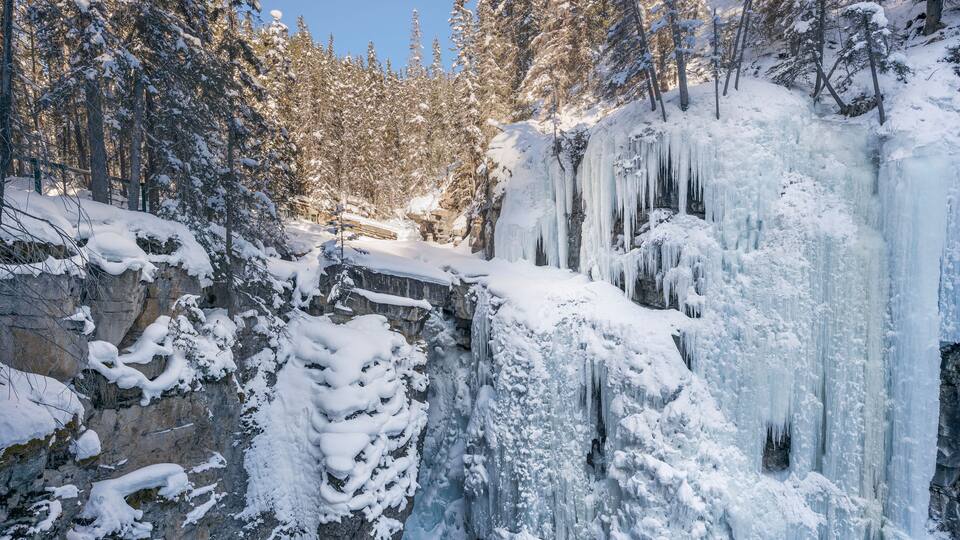 View of frozen Upper Falls at Johnston Canyon in Banff National Park, Alberta, Canada