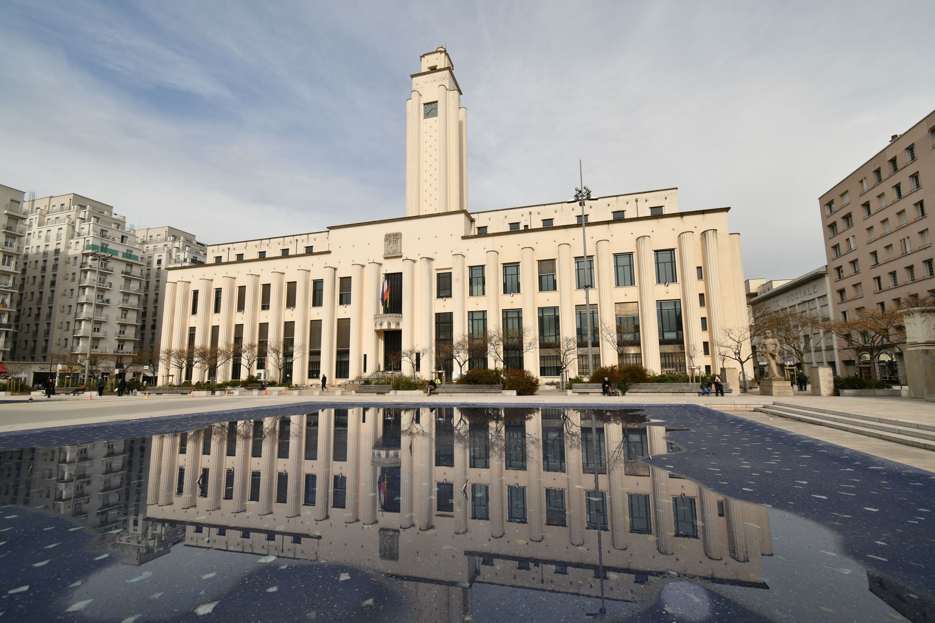 Villeurbanne City hall with square
 Lazare Goujon in the foreground in Lyon suburb.Build in 1930 at the initiative of Lazare Goujone.