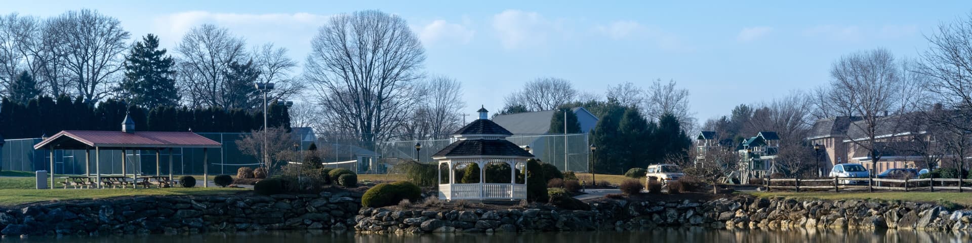 A small pond with a gazebo reflecting in the water, on a beautiful, calm and quiet day, Lancaster County, PA