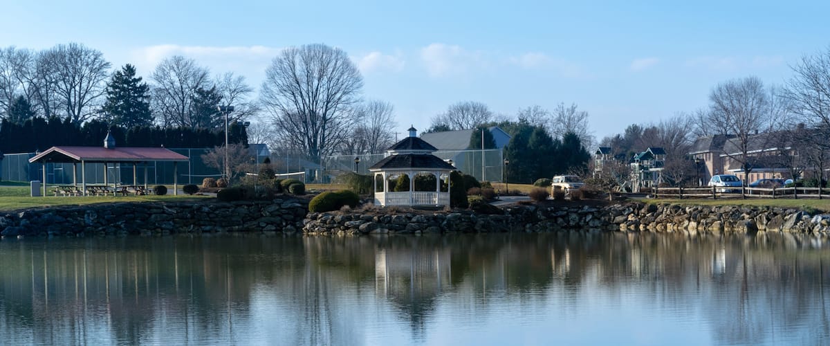A small pond with a gazebo reflecting in the water, on a beautiful, calm and quiet day, Lancaster County, PA