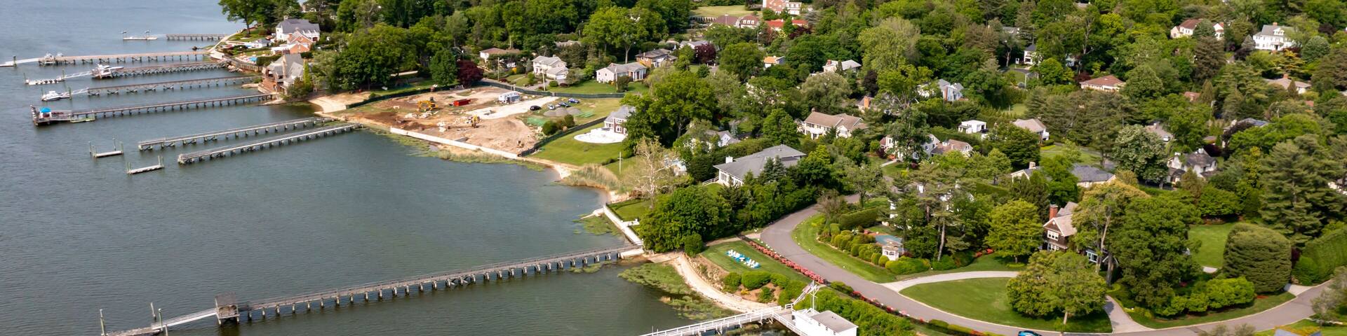 Aerial view, Long Island Coast Plandome, piers manhasset bay drone green