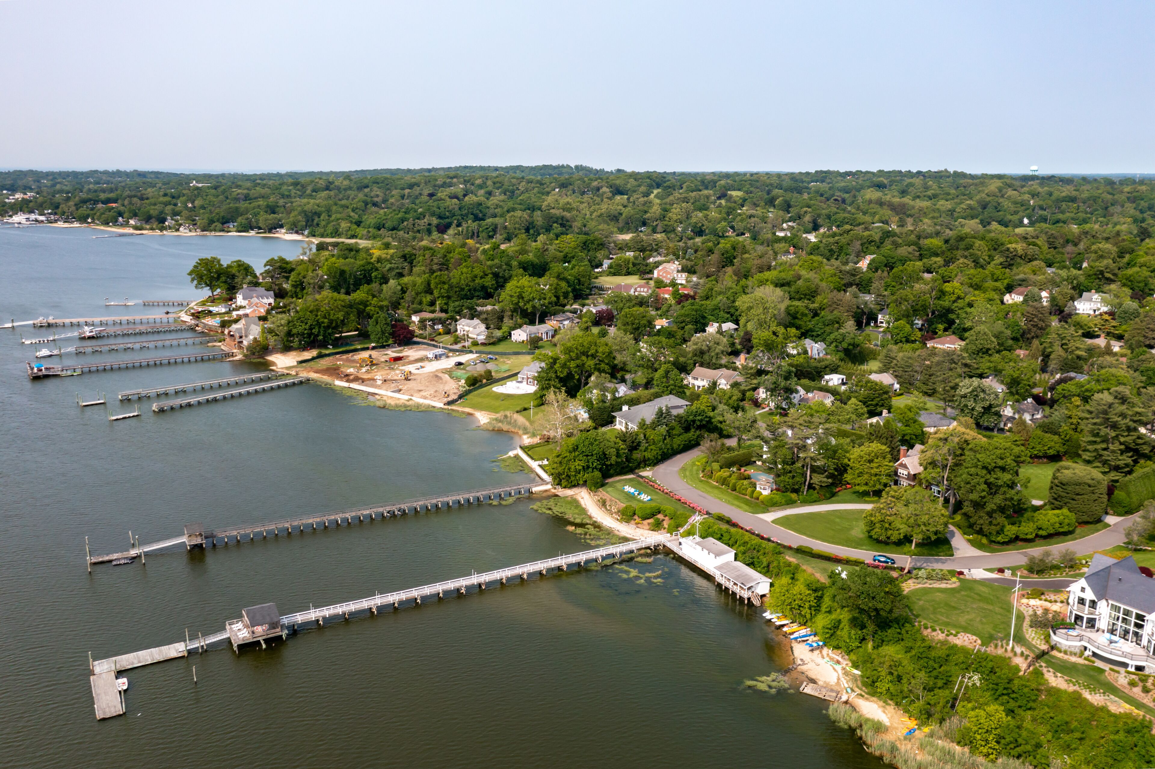 A lakeside community with docks, houses, and a marina.