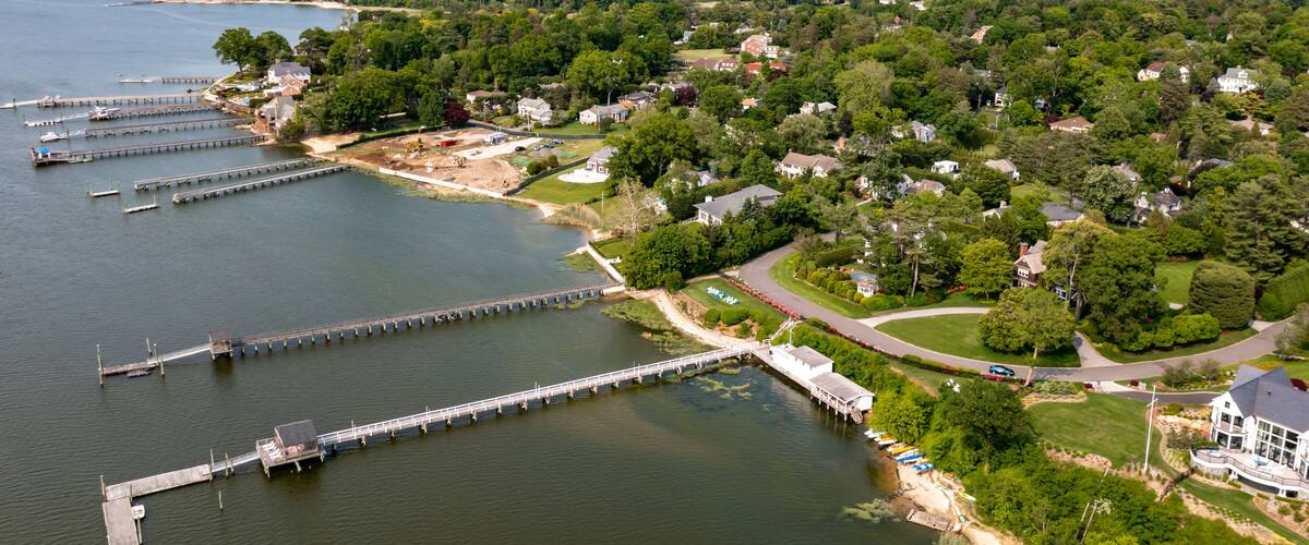 A lakeside community with docks, houses, and a marina.