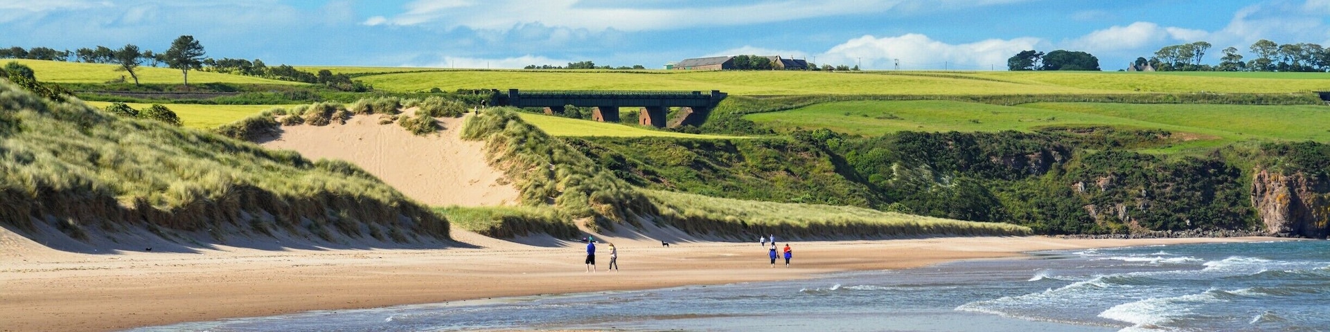 Take a off the map to a place that you think is a private property. Walk among fields of wheat and finally the view opens to the amazing ocean hitting this secluded beach. A gem hidden behind a field of farms.