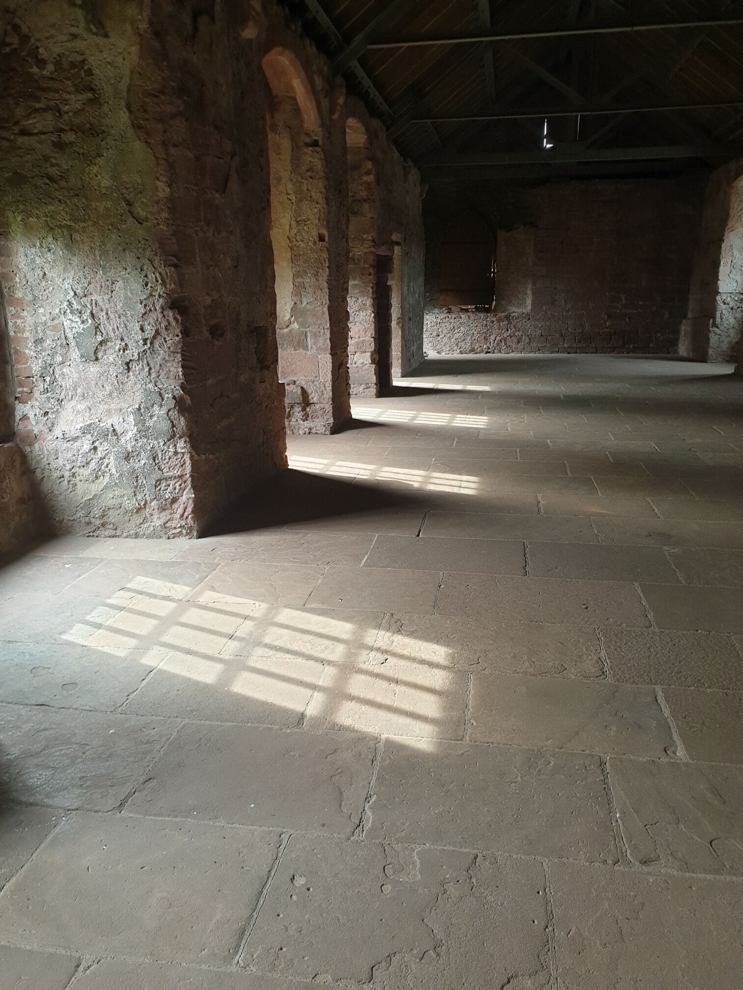 The sun shining through the windows of the abbey