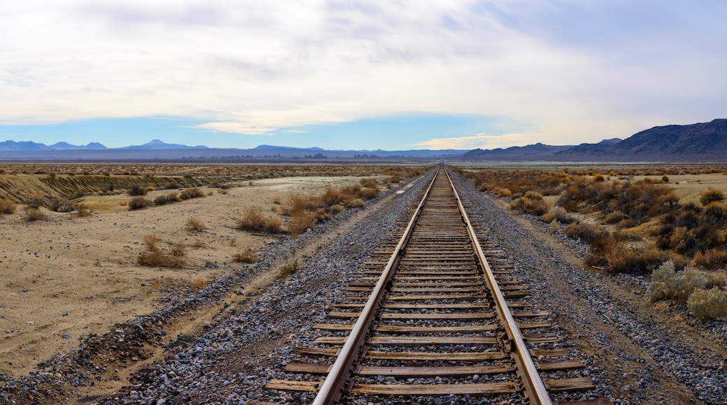 Endless Journey: 4K Ultra HD Image of Railroad Tracks in the Desert