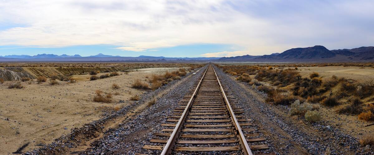 Endless Journey: 4K Ultra HD Image of Railroad Tracks in the Desert