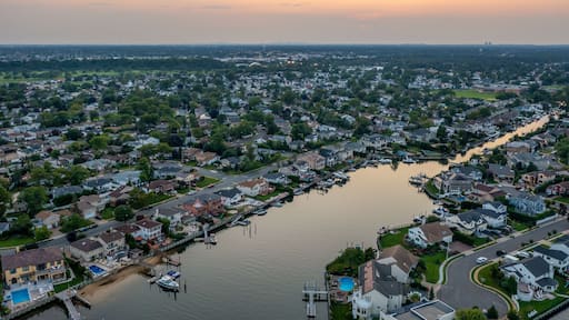 Merrick Long island at sunset aerial view bay homes canals boats orange