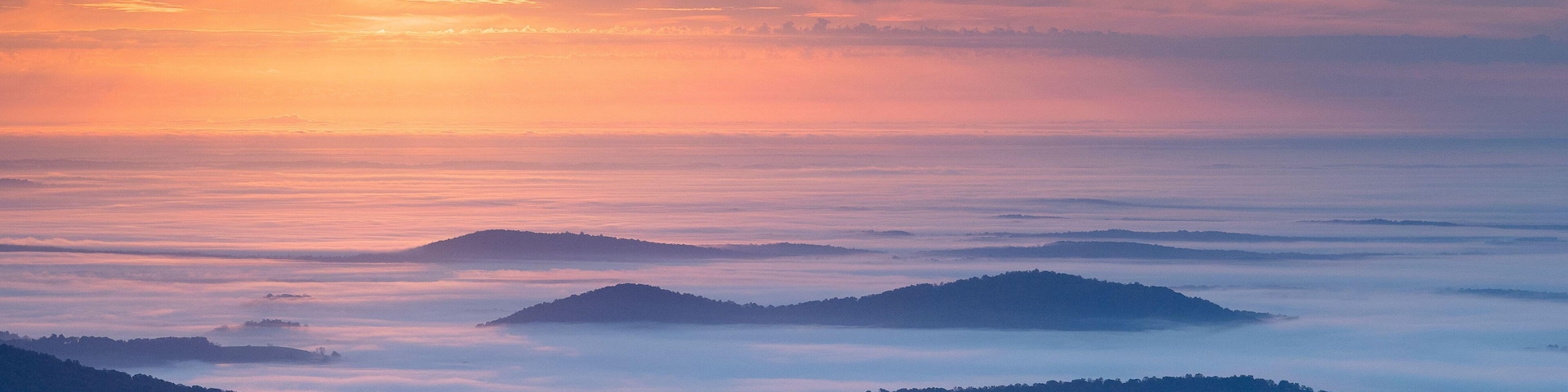 Autumn morning mist shrouds the Shenandoah Mountains in the Blue Ridge Mountains of Virginia.