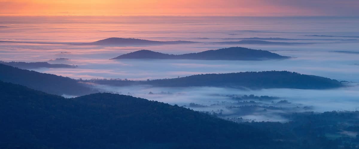 Autumn morning mist shrouds the Shenandoah Mountains in the Blue Ridge Mountains of Virginia.