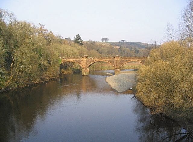 Auldgirth Bridge Spans the River Nith and closed to vehicular traffic. Viewed from the modern road bridge.