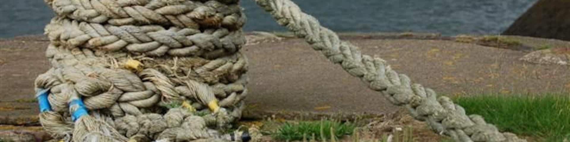 Charlestown harbour. A view westwards from the outer wall 475457 to the three cranes at the Royal Navy Armament Depot at Crombie.