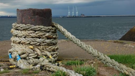 Charlestown harbour. A view westwards from the outer wall 475457 to the three cranes at the Royal Navy Armament Depot at Crombie.
