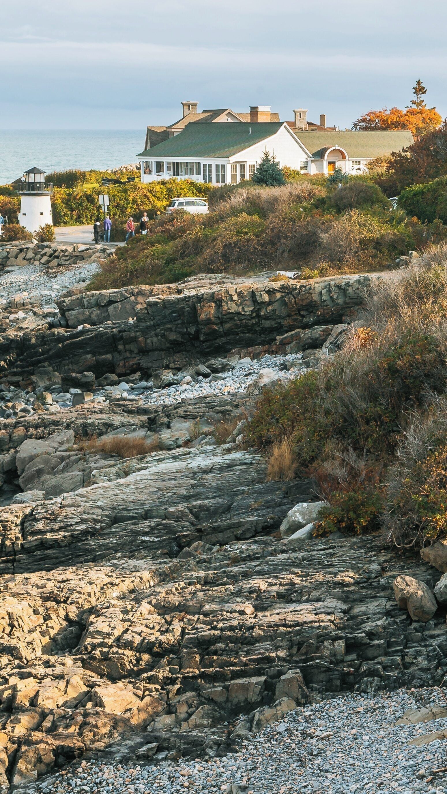Exploring the coastline of Marginal Way in Ogunquit, Maine with scenic views of rocky shores and charming architecture