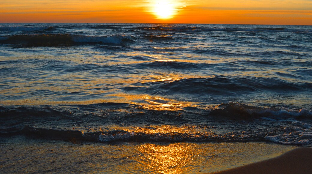 Brilliant sunrise over the waters of Lake Huron in Oscoda, Michigan